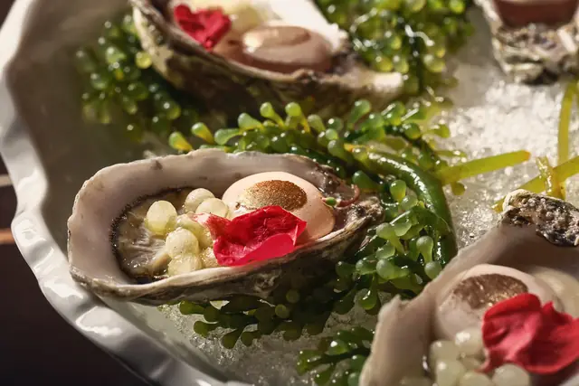 Oysters on ice with sea grapes and pickled petals